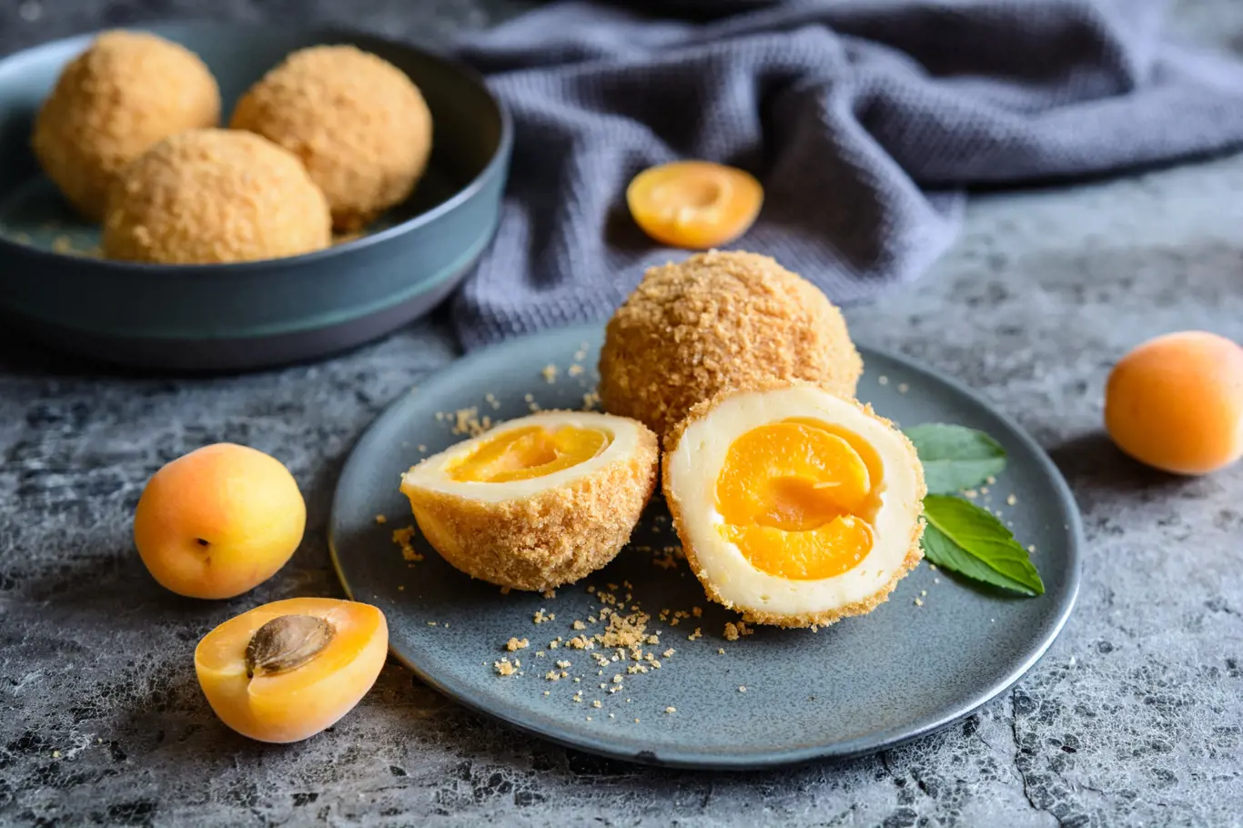 Marillenknödel – traditional Austrian sweet dumplings stuffed with apricot and coated with breadcrumbs